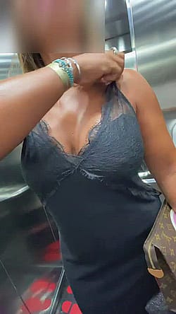 Busty MILF Flashing The Elevator Cam'