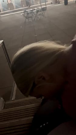 Slutty blonde sucking cock in public'