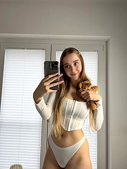 Blonde Teen Takes Selfie in White Bikini'