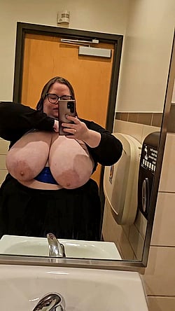 Big Tit Babe Takes Selfie in Bathroom Mirror'