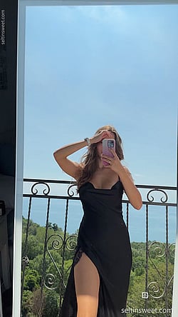 Cute Teen Takes Selfie in Black Dress'