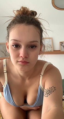 18-Year-Old Girl Shows Off Her Big Tits and Heavy Knockers'