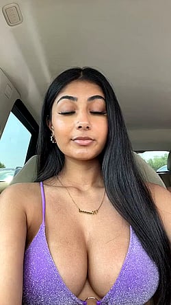 Indian TikTok Star Shows Off Her Tits in a Purple Tank Top'