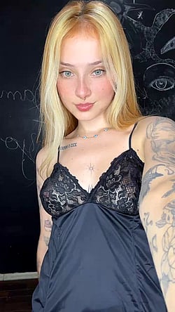 Tattooed Babe Shows Off Her Boobs'