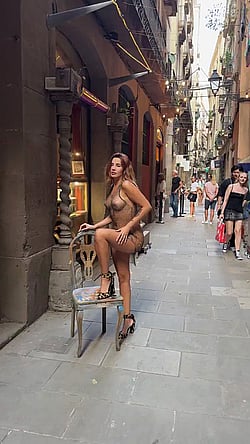 Naked Model Posing on Sidewalk'