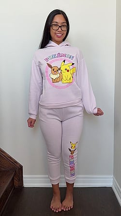 Asian girl with big ass and thick glasses posts cute Pokemon sweater on TikTok'