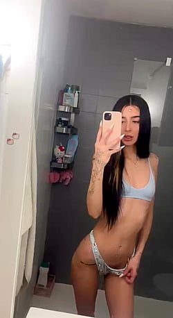 Slutty Teen Girl Shows Off Her Body in a Bathroom Mirror'