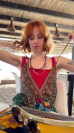 Woman Takes Off Clothes in Restaurant'