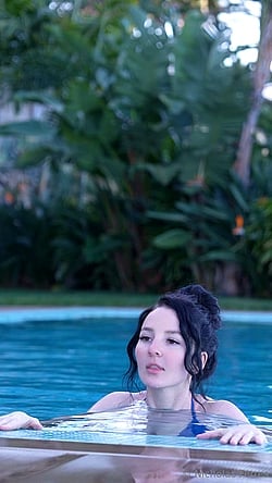 Busty Bikini Babe Comes Out of the Pool'